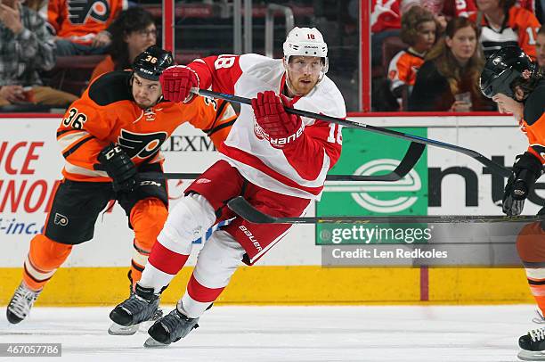Joakim Andersson of the Detroit Red Wings skates against Zac Rinaldo of the Philadelphia Flyers on March 14, 2015 at the Wells Fargo Center in...