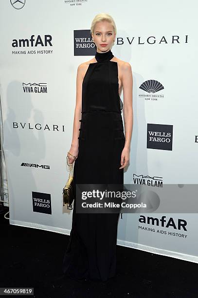 Model Sasha Luss, wearing Bulgari, attends the 2014 amfAR New York Gala at Cipriani Wall Street on February 5, 2014 in New York City.