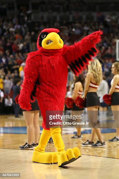 The Louisville Cardinals mascot walks on the court during a timeout in the first half against the UC Irvine Anteaters during the second round of the...