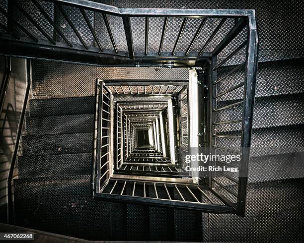 view down a stairwell - spiral staircase stock pictures, royalty-free photos & images