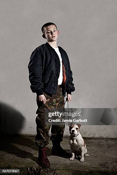 young male skinhead with a puppy - male bomber jacket stock pictures, royalty-free photos & images
