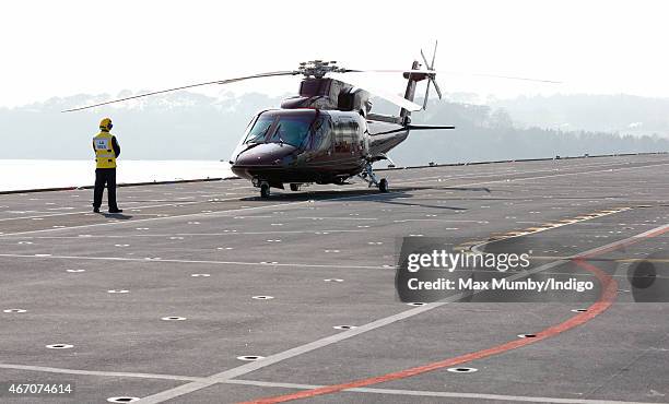 Queen Elizabeth II's helicopter on the flight deck of HMS Ocean seen prior to her departure, following a visit to the ship at HM Naval Base Devonport...