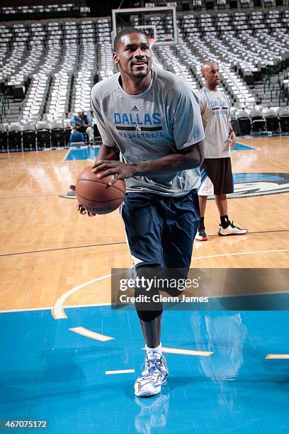 Bernard James of the Dallas Mavericks shoots during pre-game warm ups against the Memphis Grizzlies on March 20, 2015 at the American Airlines Center...
