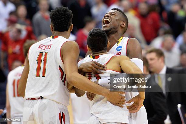 Jonathan Graham and Varun Ram of the Maryland Terrapins react after defeating the Valparaiso Crusaders during the second round of the Men's NCAA...