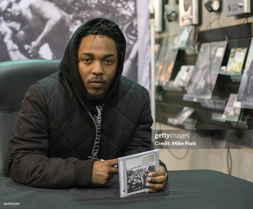 Kendrick Lamar Signs Copies Of His New Album "To Pimp A Butterfly"