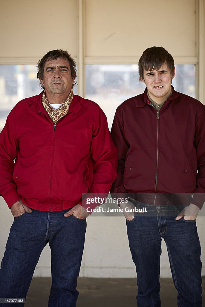 Father and Son scooter enthusiasts stood together