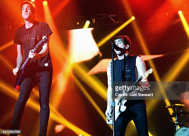 Jack Barakat and Alex Gaskarth of All Time Low perform on stage at Wembley Arena on March 20, 2015 in London, United Kingdom.