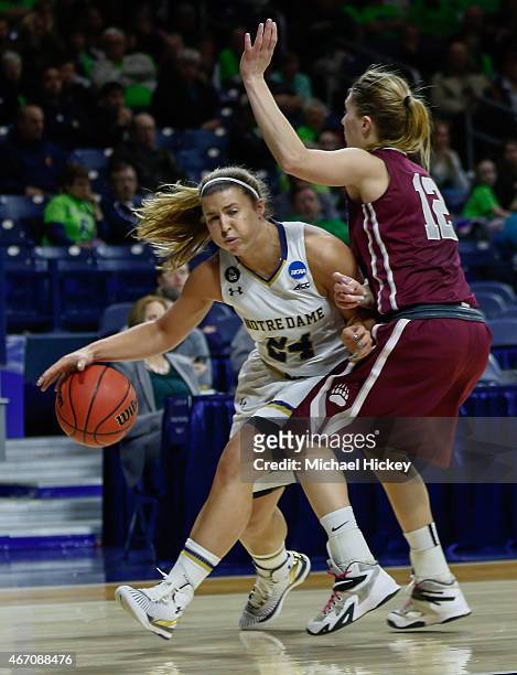 Hannah Huffman of the Notre Dame Fighting Irish dribbles the ball against Kellie Rubel of the Montana Lady Grizzlies during the first round of the...