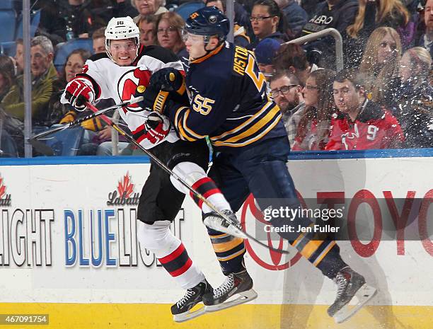 Rasmus Ristolainen of the Buffalo Sabres checks Jacob Josefson of the New Jersey Devils at First Niagara Center on March 20, 2015 in Buffalo, New...