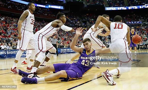 Greig Stire of the Albany Great Danes looses the ball against the Oklahoma Sooners in the second half during the second round of the 2015 NCAA Men's...