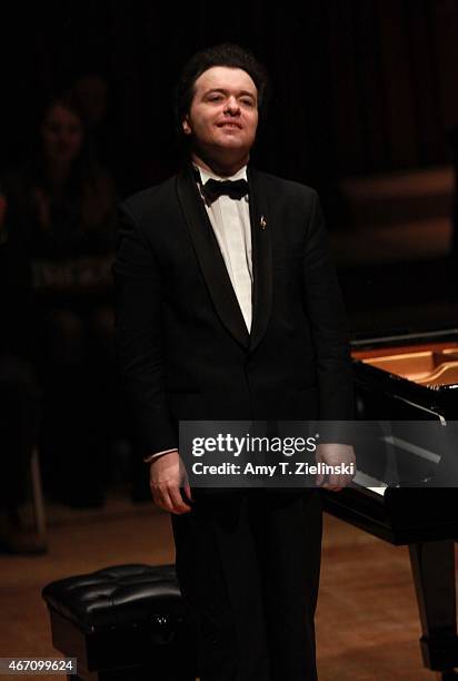 Russian concert pianist Evgeny Kissin receives applauds from the audience after performing a solo piano recital with works by composers Beethoven,...