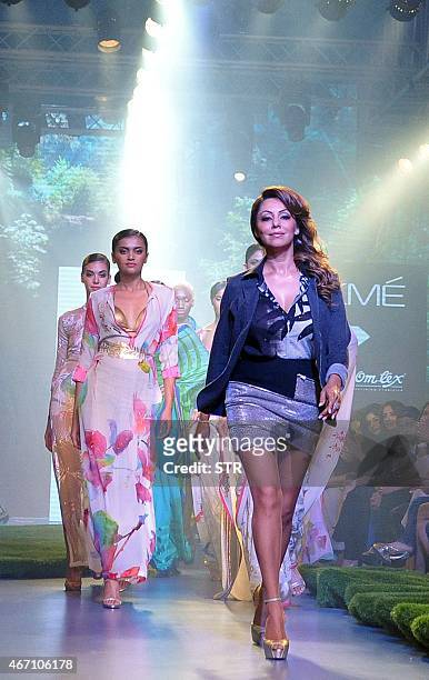 Indian Bollywood producer and wife of actor Shah Rukh Khan, Gauri Khan showcases a creation by designer Satya Paul on the third day of the Lakme...