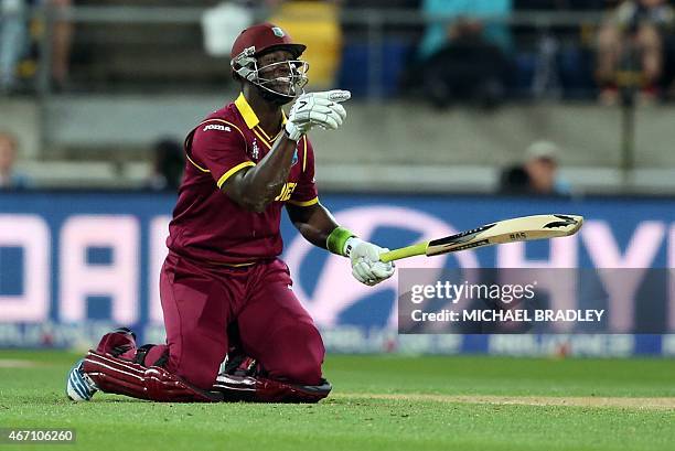 West Indies' Darren Sammy reacts after avoiding a bouncer during the Quarter Final Cricket World Cup match between New Zealand and the West Indies...
