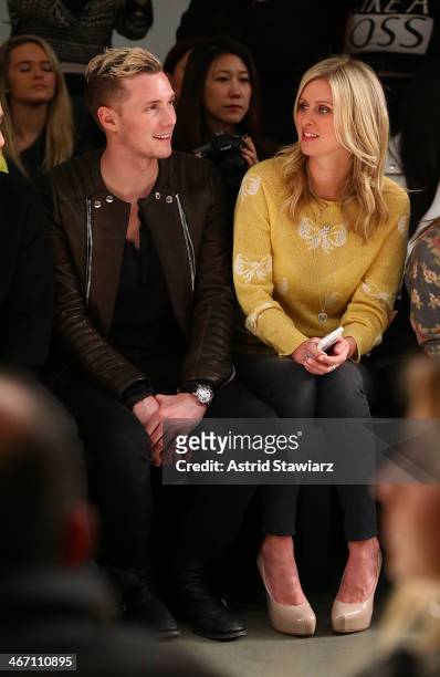 Barron Hilton and Nicky Hilton sit front row to watch Wildfox fashion show during Mercedes-Benz Fashion Week Fall 2014 at Pier 59 on February 5, 2014...