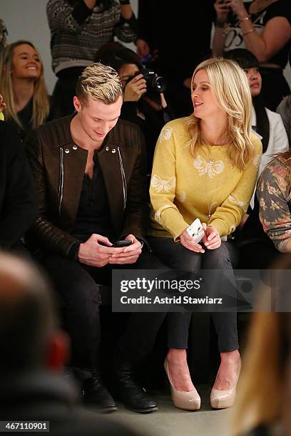 Barron Hilton and Nicky Hilton sit front row to watch Wildfox fashion show during Mercedes-Benz Fashion Week Fall 2014 at Pier 59 on February 5, 2014...