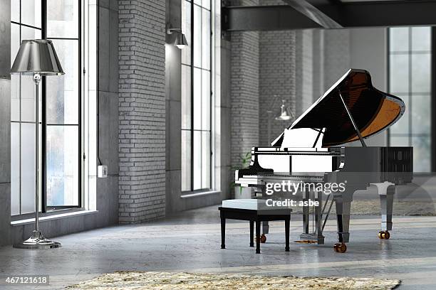 sleek black grand piano in well lit room - piano stockfoto's en -beelden