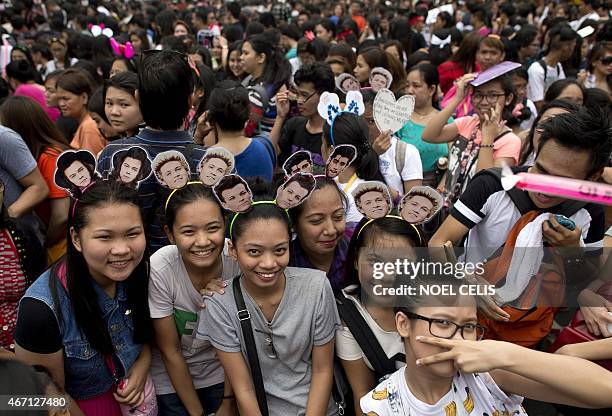 Filipino fans queue up to watch the One Direction concert in Manila on March 21, 2015. One Direction star Zayn Malik quit the world tour of the...