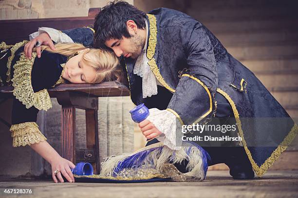 desperate romeo with juliet drinking the poison - juliet capulet stock pictures, royalty-free photos & images