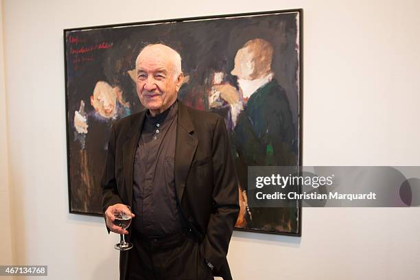 Armin Mueller-Stahl stands next to his work during the opening of 'Menschenbilder' exhibition preview at Kunsthalle Brennabor on March 21, 2015 in...