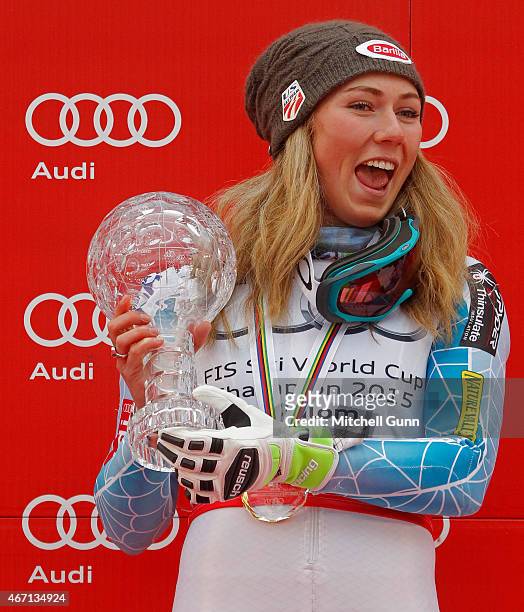 Mikaela Shiffrin of The USA poses with the crystal globe for the overall slalom winner after the FIS Alpine Ski World Cup women's slalom race on...