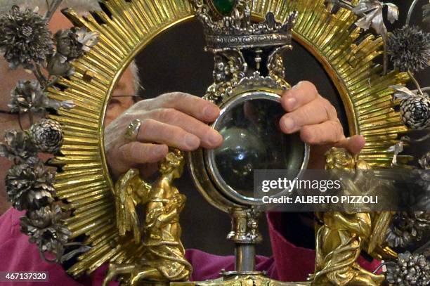 Bishop Vincenzo de Gregorio brings the ampulla that contains the blood of San Gennaro before the arrival of Pope Francis at the Duomo as part of his...