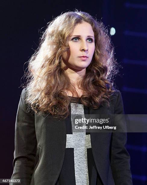 Maria Alyokhina speaks during the Amnesty International "Bringing Human Rights Home" Concert at the Barclays Center on February 5, 2014 in the...