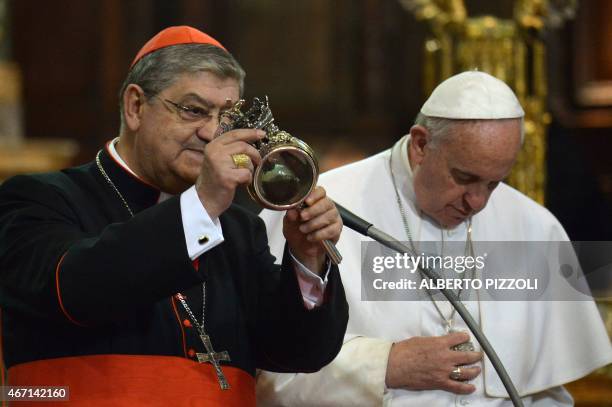 Cardinal Crescenzio Sepe , archbishop of Naples shows the ampulla containing the blood of San Gennaro during a pastoral visit of Pope Francis at the...