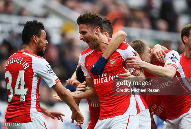 Olivier Giroud of Arsenal celebrates scoring his second goal with Francis Coquelin during the Barclays Premier League match between Newcastle United...