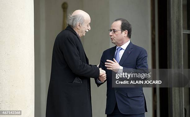 French President Francois Hollande bids farewell to Lebanese Druze leader and Lebanese Progressive Socialist Party chairman Walid Jumblatt after a...