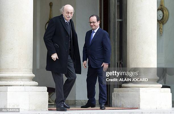 French President Francois Hollande bids farewell to Lebanese Druze leader and Lebanese Progressive Socialist Party chairman Walid Jumblatt after a...