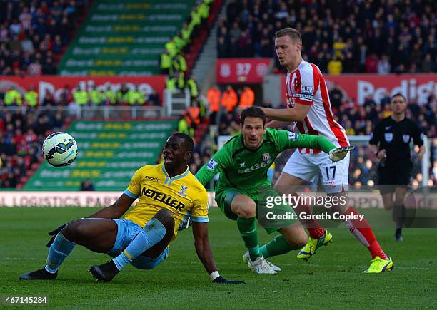 Yannick Bolasie of Crystal Palace draws a foul from Asmir Begovic of Stoke City to win a penalty during the Barclays Premier League match between...