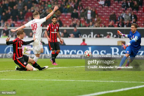 Alexandru Maxim of Stuttgart scores the 3rd team goal against Kevin Trapp, keeper of Frankfurt during the Bundesliga match between VfB Stuttgart and...