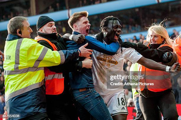 Bafetimbi Gomis of Swansea City celebrates his goal during the Barclays Premier League match between Aston Villa and Swansea City at Villa Park on...