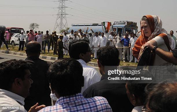 Congress President Sonia Gandhi meets with farmers during her visit at Gurwara village, Haryana, on March 21, 2015 in Rewari, India. Sonia Gandhi...