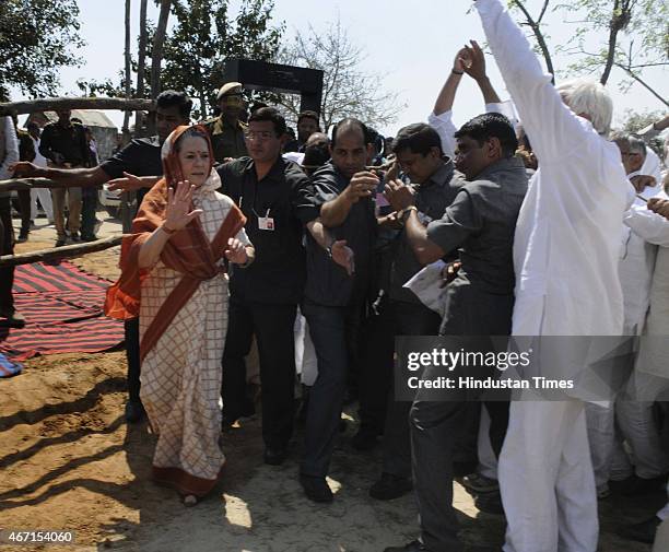 Congress President Sonia Gandhi meets with farmers during her visit at Gurwara village, Haryana, on March 21, 2015 in Rewari, India. Sonia Gandhi...