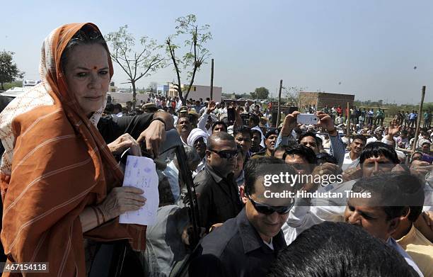 Congress President Sonia Gandhi meets with farmers during her visit at Rattanthal village, Haryana, on March 21, 2015 in Rewari, India. Sonia Gandhi...