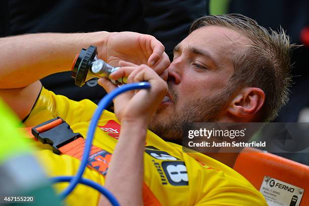 Joel Ekstrand of Watford goes off with gas and air after a bad injury during the Sky Bet Championship match between Watford and Ipswich Town at...