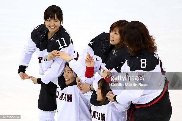 Yurie Adachi, Ami Nakamura, Akane Konishi, Kanae Aoki and Tomoe Yamane of Japan pose for a photo prior to their Women's Ice Hockey practice session...