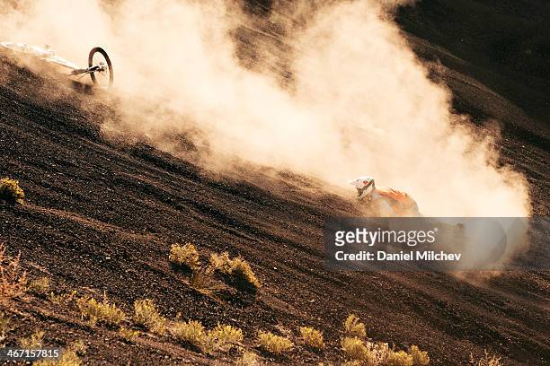 mountain bike crash on a dusty trail. - lopsided stock pictures, royalty-free photos & images