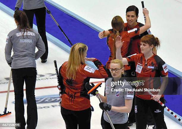 Canada team celebrates beating Russia in the semi final during day eight of the World Women's Curling Championship at Tsukisamu Gymnasium on March...