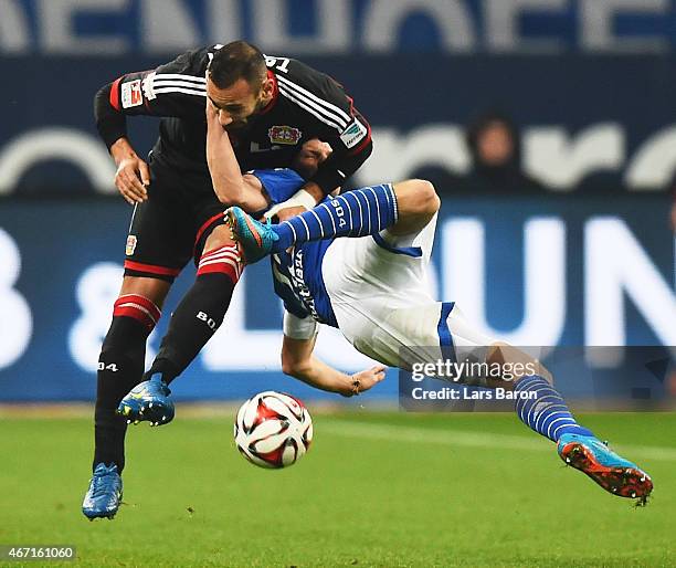 Omer Toprak of Bayer 04 Leverkusen tangles with Klaas-Jan Huntelaar of FC Schalke 04 during the Bundesliga match between FC Schalke 04 and Bayer 04...