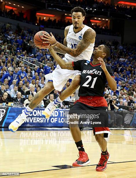 Willie Cauley-Stein of the Kentucky Wildcats drives past Farad Cobb of the Cincinnati Bearcats during the third round of the 2015 NCAA Men's...