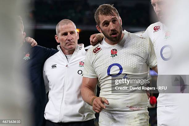 England captain Chris Robshaw speaks to his team as head coach Stuart Lancaster looks on at the end of the RBS Six Nations match between England and...