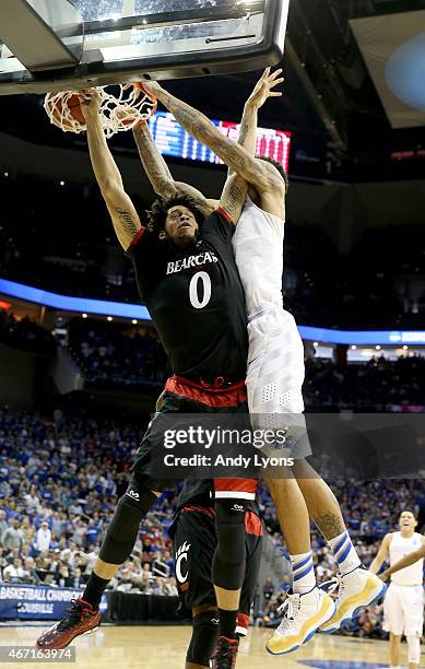Willie Cauley-Stein of the Kentucky Wildcats dunks on Quadri Moore of the Cincinnati Bearcats during the third round of the 2015 NCAA Men's...