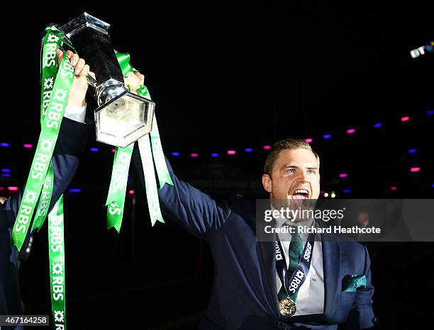 Jamie Heaslip of Ireland celebrates with the trophy after the RBS Six Nations match between Scotland and Ireland at Murrayfield on March 21, 2015 in...