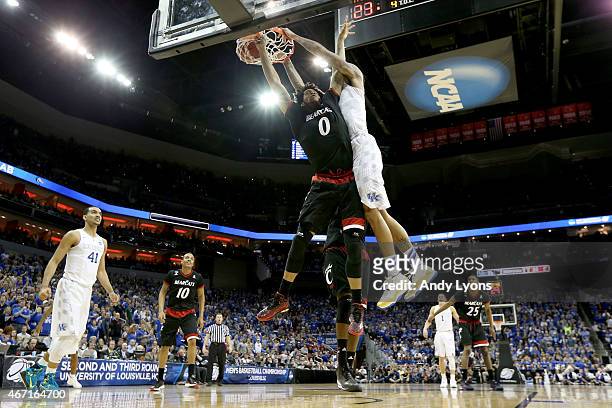 Willie Cauley-Stein of the Kentucky Wildcats dunks on Quadri Moore of the Cincinnati Bearcats during the third round of the 2015 NCAA Men's...