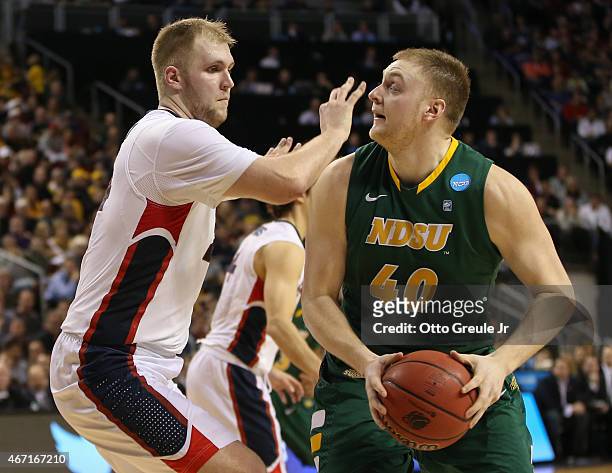 Przemek Karnowski of the Gonzaga Bulldogs defends against Dexter Werner of the North Dakota State Bisons during the second round of the 2015 Men's...