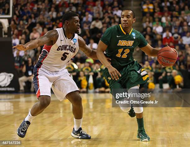 Lawrence Alexander of the North Dakota State Bisons dribbles against Gary Bell Jr. #5 of the Gonzaga Bulldogs during the second round of the 2015...