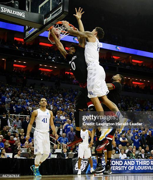 Kentucky's Willie Cauley-Stein dunks over Cincinnati's Quadri Moore in the third round of the NCAA Tournament on Saturday, March 21 at the KFC Yum!...