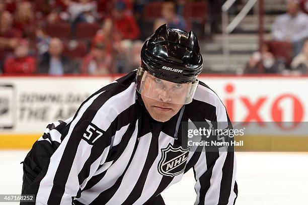 Linesman Jay Sharrers gets ready for a faceoff during a game between the Colorado Avalanche and the Arizona Coyotes at Gila River Arena on March 19,...